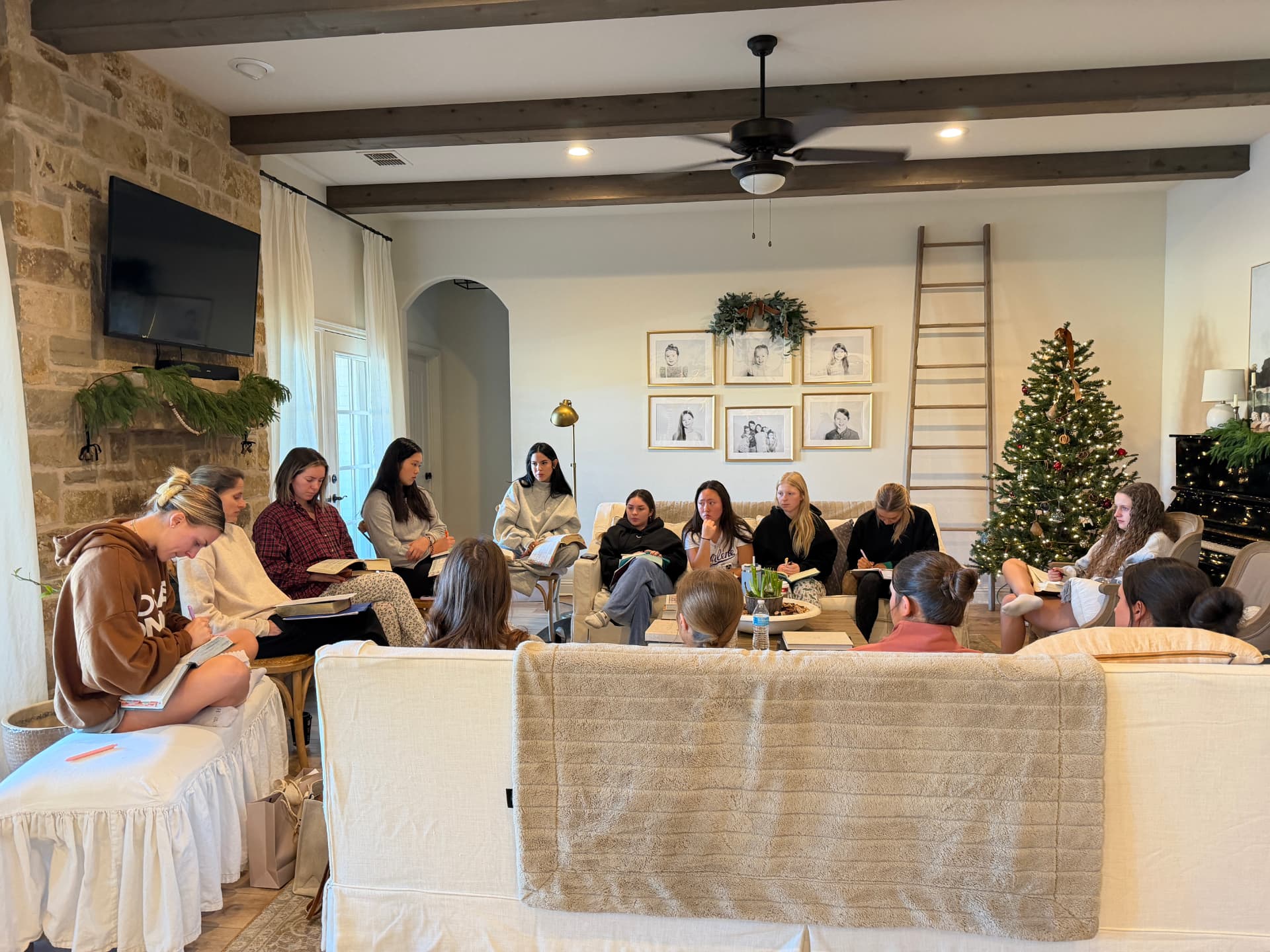College golfers gathered in a living room for a Bible study