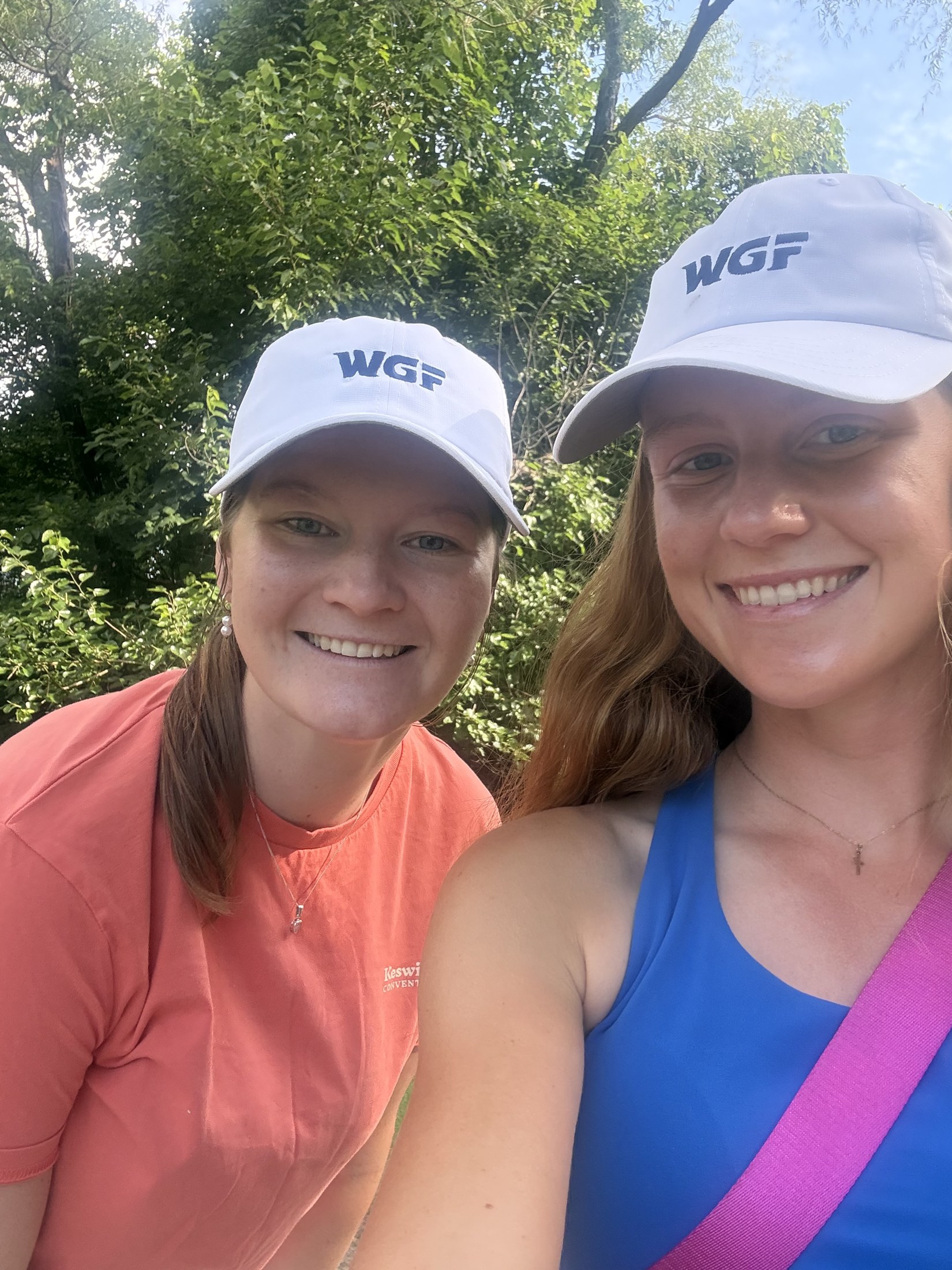 Three golfers together on the green